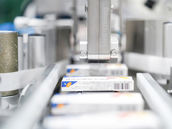 S828紙盒對（duì）角封口智能貼標機